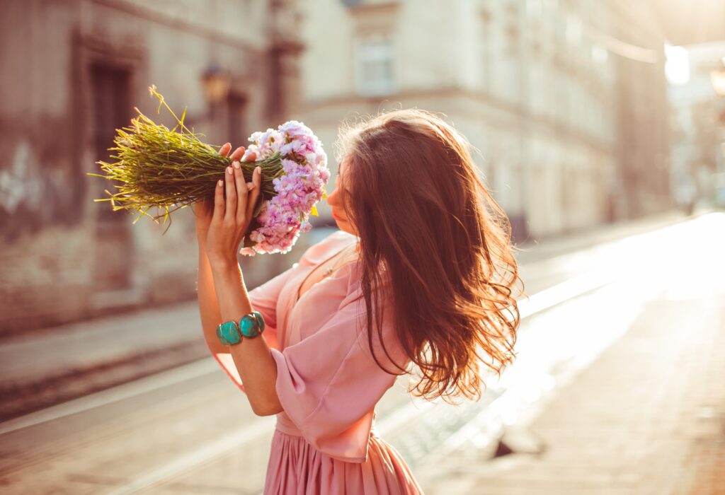 lady smelling flowers